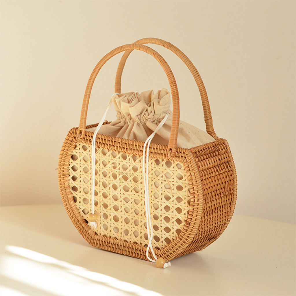 Natural rattan woven hollow oval handbag