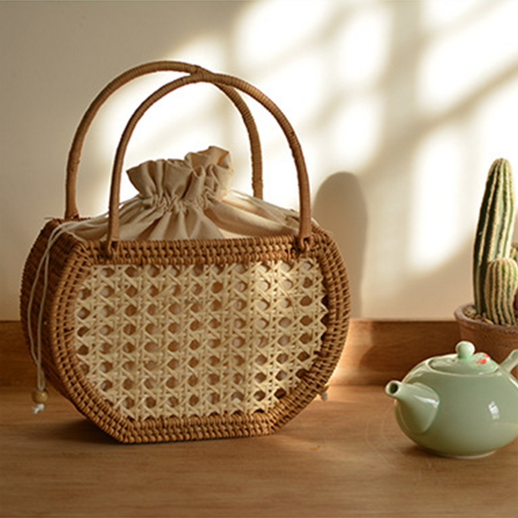 Natural rattan woven hollow oval handbag