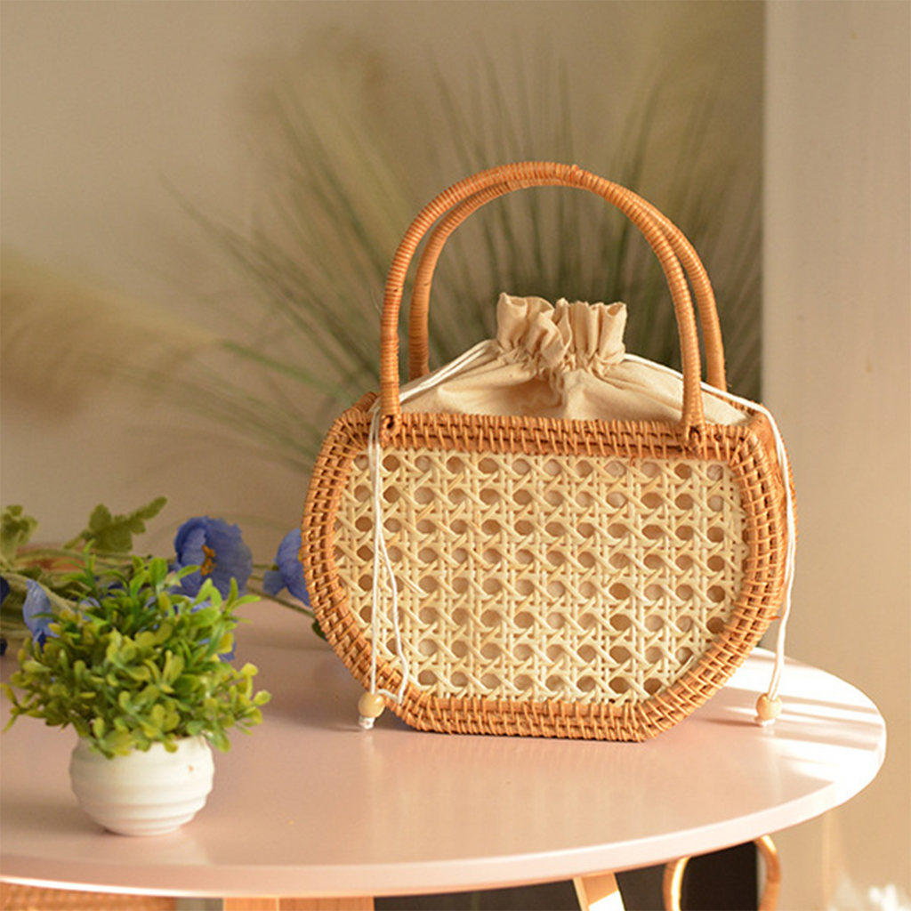 Natural rattan woven hollow oval handbag
