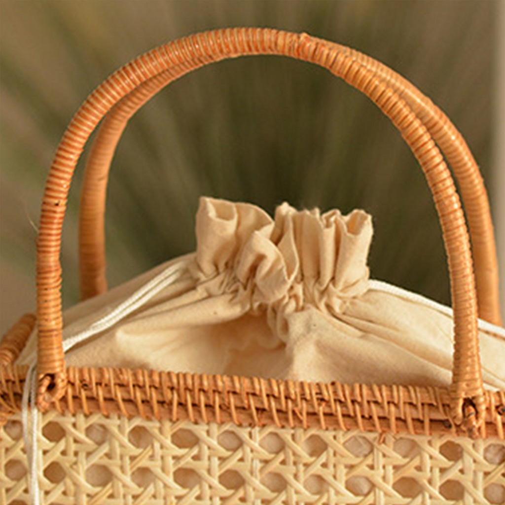 Natural rattan woven hollow oval handbag