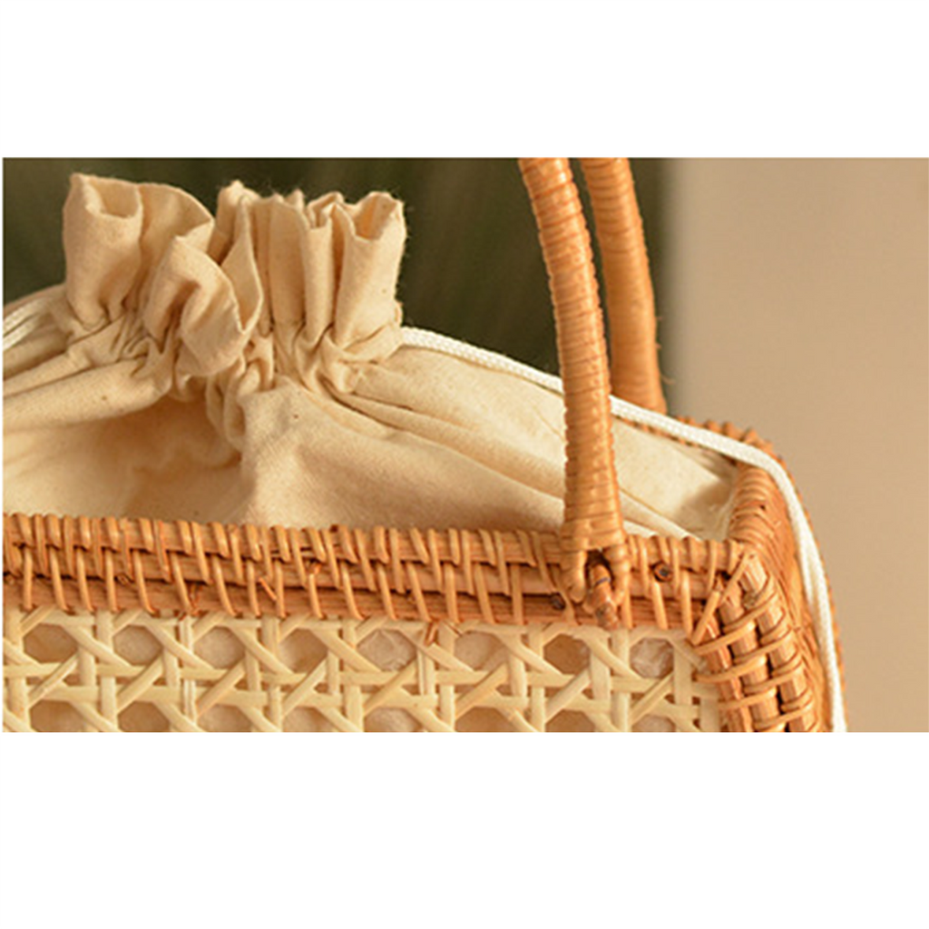 Natural rattan woven hollow oval handbag