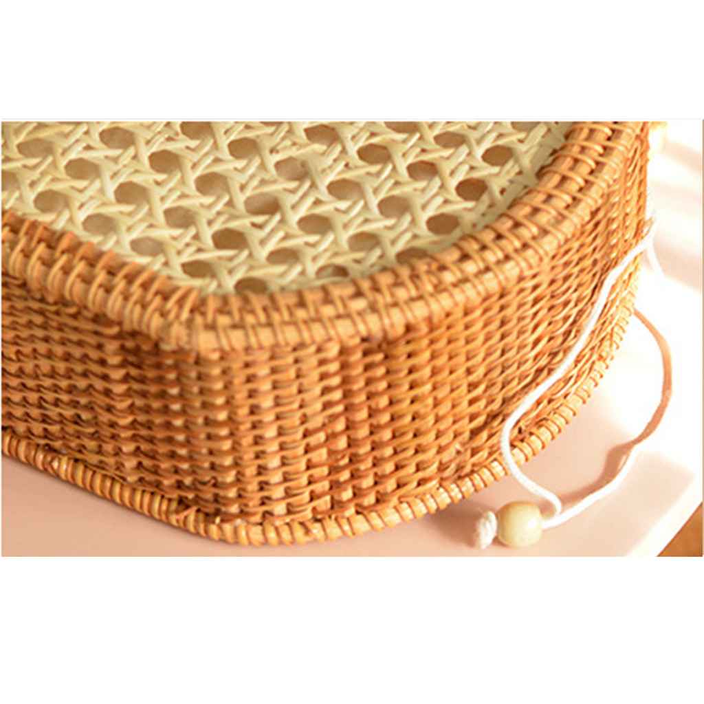 Natural rattan woven hollow oval handbag